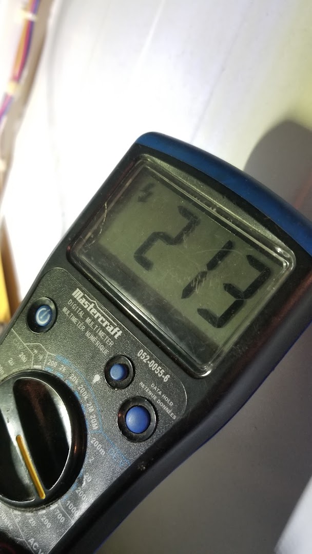 Multimeter used during an appliance diagnostic